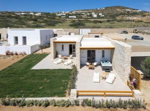 an aerial view of a house with a yard at Sunshine Alkyoni Suite in Isterni