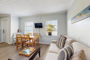 a living room with a couch and a table at CK03a Fisherman's Bungalow in Conch Key