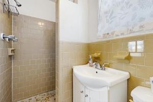 a bathroom with a sink and a toilet at CK03a Fisherman's Bungalow in Conch Key +15 photos