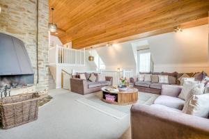 a living room with a couch and a table at 6 Bed in Hersham oc-t29211 in Stratton