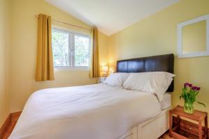 a bedroom with a large white bed and a window at 2 Bed in St. Merryn oc-p00883 in Saint Merryn