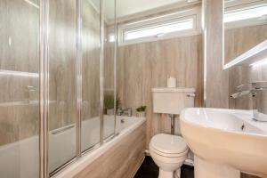 a bathroom with a toilet and a sink and a shower at 2 Bed in St. Merryn oc-p00883 in Saint Merryn +12 photos