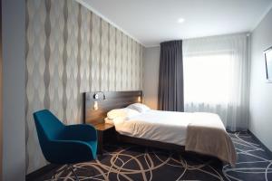 Posteľ alebo postele v izbe v ubytovaní Hotel Nad Nettą