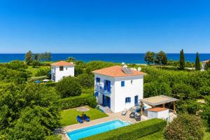 an aerial view of a villa with a swimming pool at Villa Rotiana in Polis Chrysochous