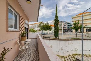 a balcony with a view of a street at Casa Solace in Almada