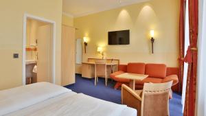 TV a/nebo společenská místnost v ubytování Hotel Mack Private Inn