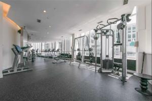 a gym with rows of treadmills and machines at Downtown Toronto Condo in Toronto