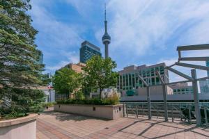 a view of a city with the cn tower in the background at Downtown Toronto Condo in Toronto