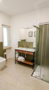 a bathroom with a sink and a shower at Locazione Turistica Dal Degan 2 in San Bonifacio +14 photos