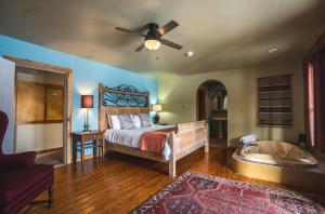 a bedroom with a bed and a bath tub at Point Au Roche Lodge in Plattsburgh