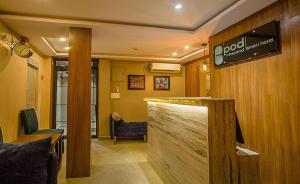 Area lobi atau resepsionis di Pod N Beyond Smart Hotel