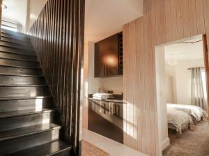 a room with a staircase leading to a bedroom at Hanowen House in Dungloe