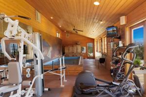 a fitness room with a gym with tread machines at The Bubbling Wells Oasis, 3 Homes on 107 Acres in Desert Hot Springs