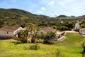 an image of a house with a green yard at Finca Santa Teresa, Casa La Higuera in Casares