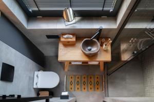 a bathroom with a sink on a wooden table at РІЗНОтрав'я in Solygy