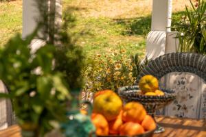 a basket of oranges and pears on a table at Finca Santa Teresa, Casa La Higuera in Casares