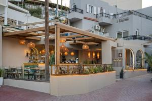 a restaurant on the side of a building at Bali Seaside Sailor in Bali