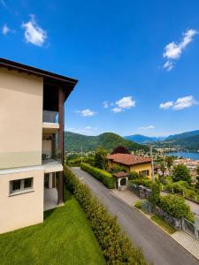 a house with a view of a road at Lake View Apartament 39 - Free Parking & Terrace in Cadegliano Viconago