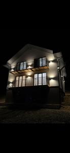 a lit up building with windows at night at House on The Hill Bukovel in Palyanytsya
