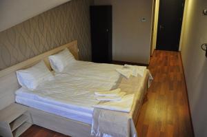 Postel nebo postele na pokoji v ubytování Hotel Imperial