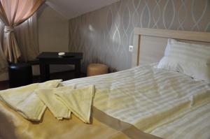 Postel nebo postele na pokoji v ubytování Hotel Imperial