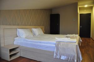 Postel nebo postele na pokoji v ubytování Hotel Imperial