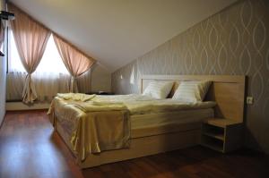 Postel nebo postele na pokoji v ubytování Hotel Imperial