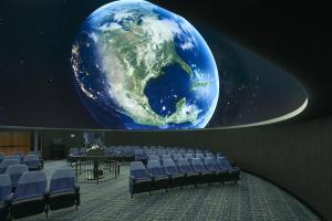 a room with a mural of the earth on the wall at Holiday Inn Express & Suites Oceanfront Daytona Beach Shores by IHG in Daytona Beach +66 photos