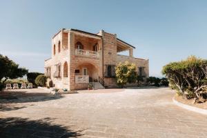 a large stone house with a large driveway at Villa Incina - Sea House in Polignano a Mare