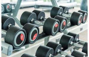 a row of dumbbells in a gym at Americas Best Value Inn Irving DFW Airport South in Irving