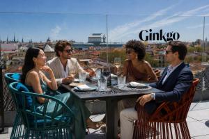 a group of people sitting around a table at VP Plaza España Design in Madrid