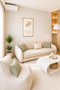 a living room with a couch and a table at Beograd na vodi-Belgrade Waterfront in Belgrade