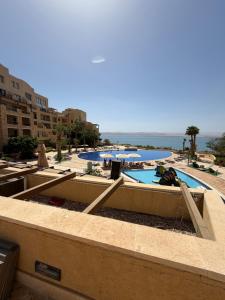 a view of a swimming pool in a resort at Samara in Sowayma