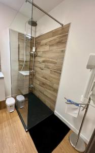 a bathroom with a shower with a glass door at Escapade cosy proche nature in Saint Die +19 photos
