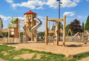 a playground with a slide in a park at Escapade cosy proche nature in Saint Die