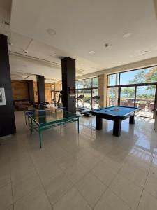 a large room with two ping pong tables in it at Samara in Sowayma