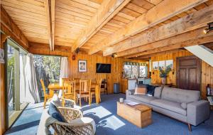 a living room with a couch and a table at Adventure Base in Ohakune