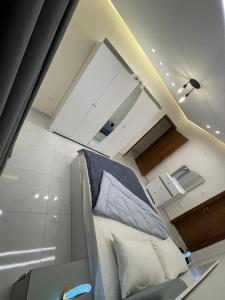 a living room with a couch in a room at A Spacious, Stylish, and Perfectly Located in the heart of Cairo - Two bedroom Condo! in Cairo +108 photos
