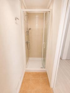 a shower with a glass door in a bathroom at Casa del Marinaio - Agenzia Cocal in Caorle