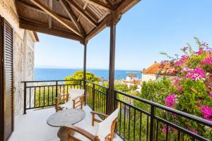 a balcony with a view of the ocean at Villa Metochi in Skala