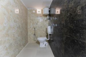 a bathroom with a toilet and a shower at Emperor Palace Heritage Villa Udaipur in Udaipur +75 photos