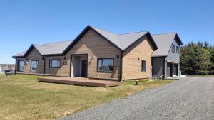 a house on the side of a road at Opulence Suite-Luxury New Build with Riverview in Montague