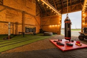 a large room with a bottle of wine on a red tray at Domaine pour 27 pers avec SPA et GRANGE Festive in Saint-Justin