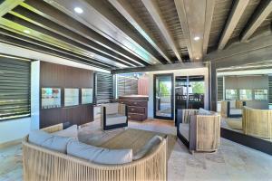 a living room with a couch and some chairs at apartement rooftop oceanfront - Hotel Aligio in Las Terrenas