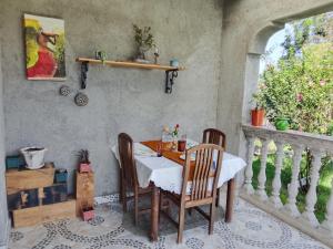 a dining room with a table and chairs and a window at Sereni stays in Nakuru
