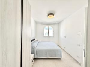 a bedroom with a bed and a window at Conero View in Marcelli