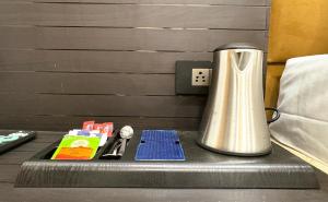 a blender sitting on a table next to a bed at Hotel Pearl Nest Palace in Agra