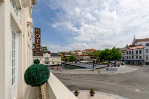 a building with a christmas tree on a balcony at TURIM Aveiro Palace Hotel in Aveiro