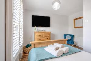 a bedroom with a bed and a flat screen tv at 1 Bed in Middlesbrough oc-79273 in Great Ayton