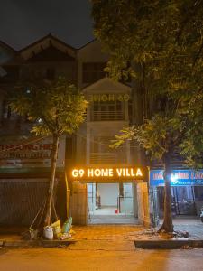 a sign that says go home villa in front of a building at G9 Home hotel in Hanoi +14 photos